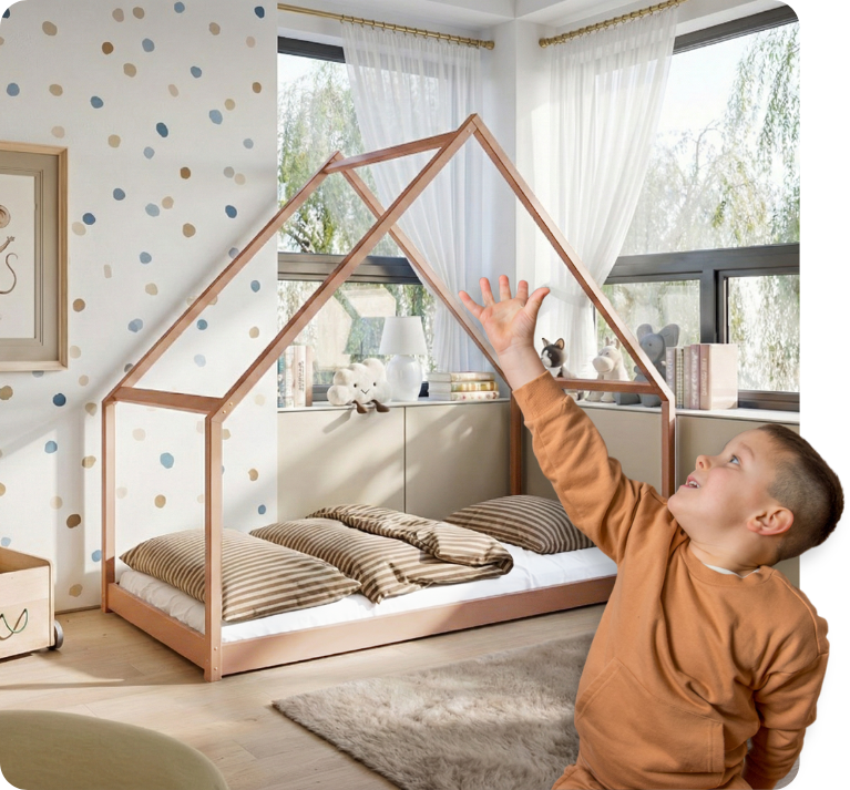 A boy points to a cinnamon-coloured house bed behind him