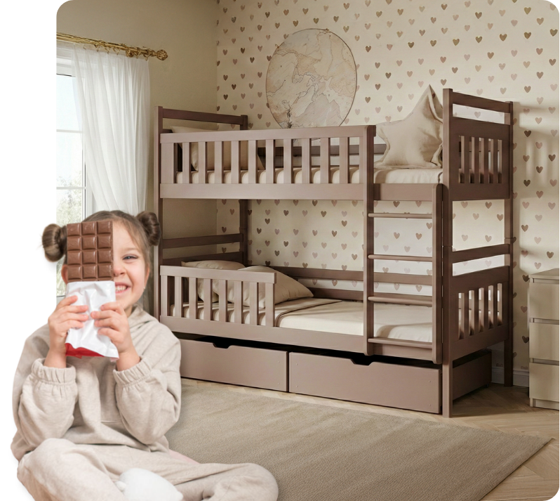 A smiling girl sits holding chocolate in front of a chocolate-coloured bunk bed